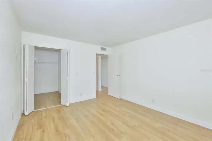 A large walk-in closet is perfect for storage needs.