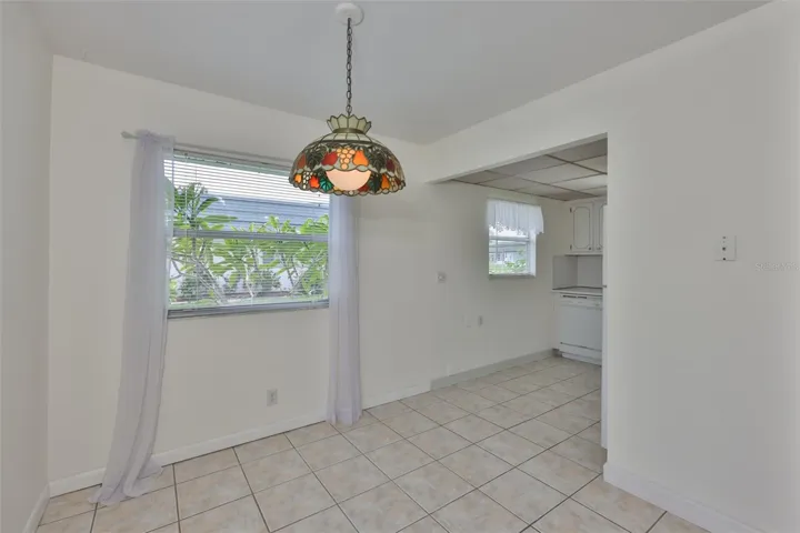 The dining area is conveniently next to the kitchen.