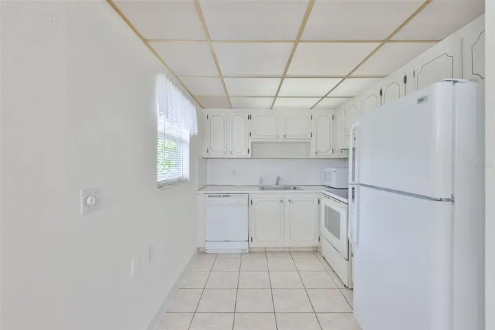 A small bistro table could easily fit into this bright kitchen.