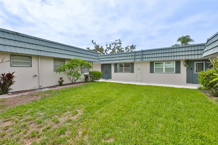 The unit looks out onto a large and open green space.