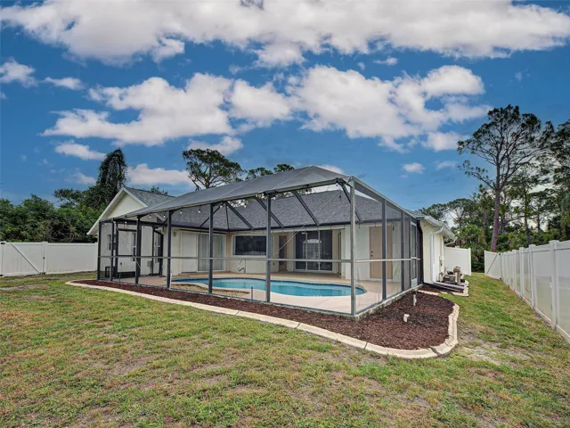 back of the home, fenced-in backyard