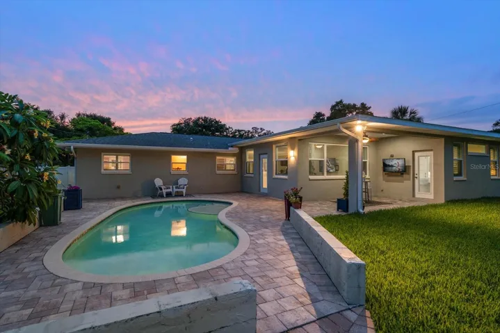Relax in the pool or on the covered patio, this property provides welcoming choices for all who live here.