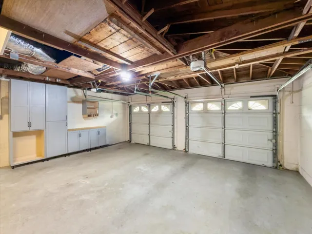Oversized two car garage with built in storage units.