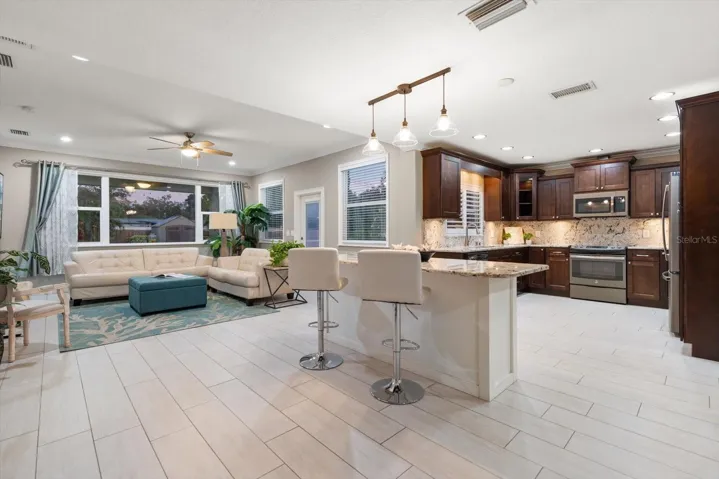 Family room flows seamlessly into a gourmet kitchen, perfect for everyday living and extertaining!