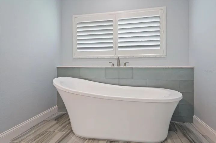 Enjoy soaking in the tub in the primary bath retreat!