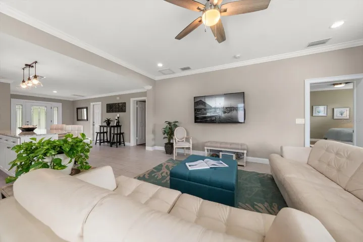 Spacious great room with satellite island, and high ceilings.