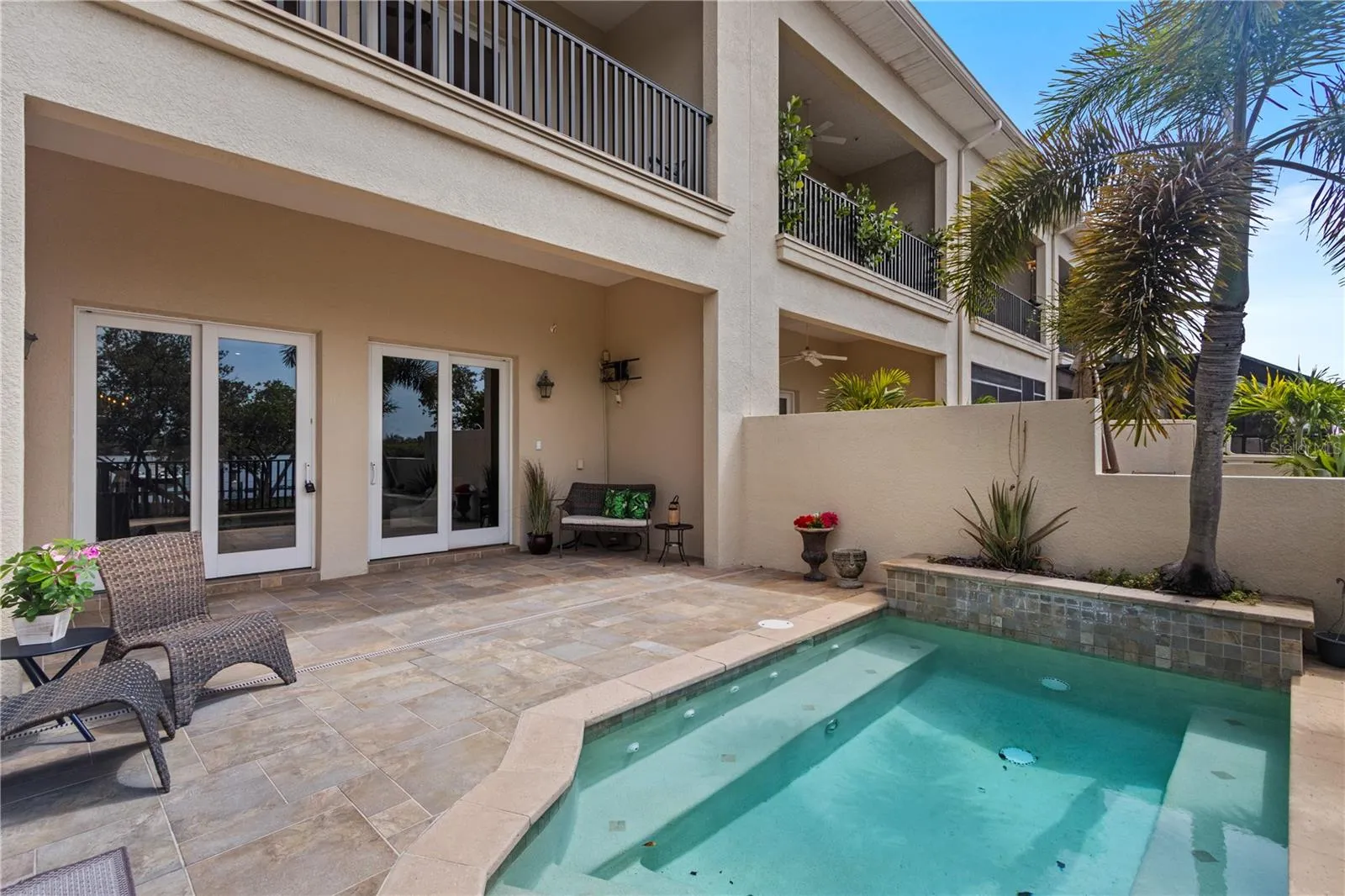 Gated private patio with plunge pool. There is also a community pool across the street.