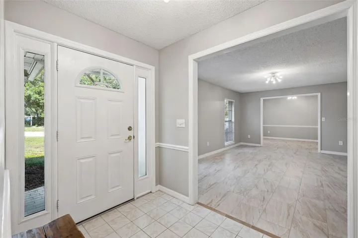 Foyer into dining room/living room combo