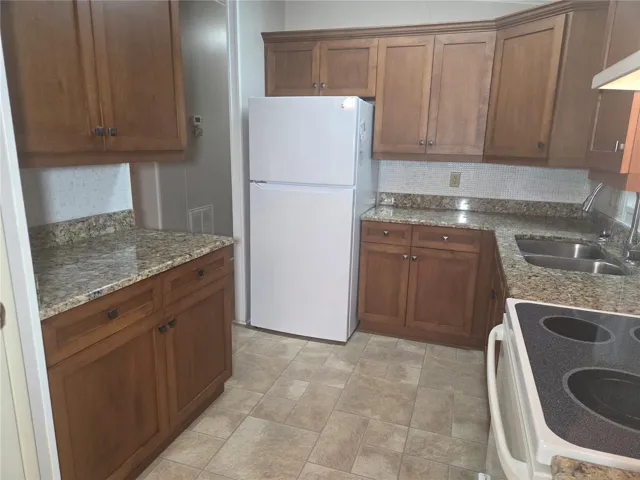 Kitchen showing beautiful cabinets and granite counter tops