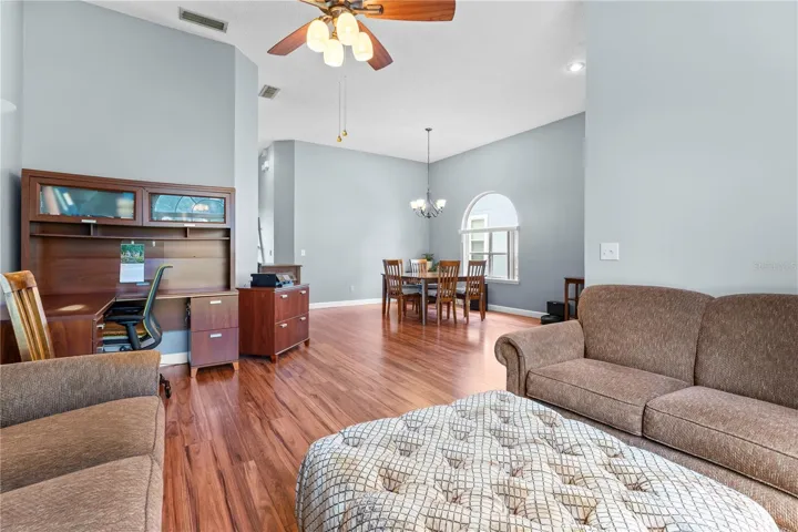 The living room connects to the dining room