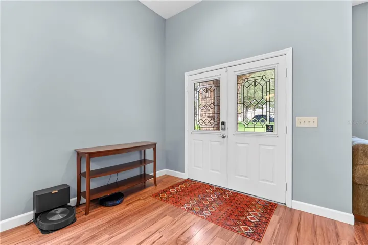 Large open foyer with leaded glass front doors