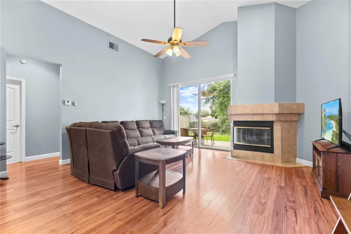 Family room with fireplace opens up to the back patio