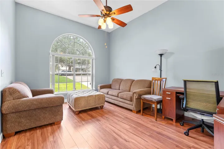 Living room with large front window to bring in ons of natural light