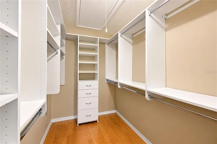 Primary bedroom walk-in closet