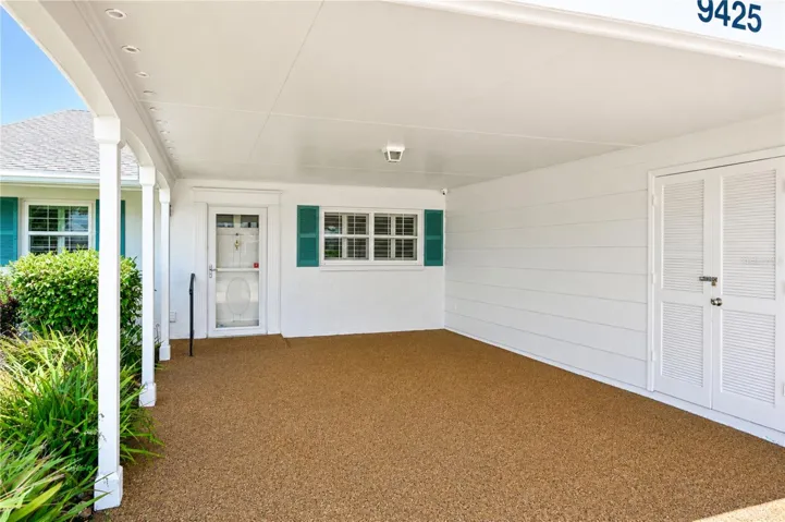 Wide carport with refreshed Polly-Pebble flooring & secure outdoor storage