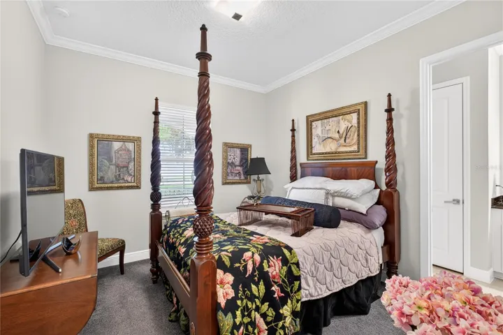 upper level fourth bedroom with carpet