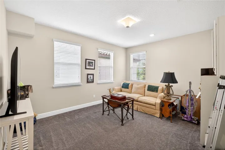 third bedroom on the upper level with carpet