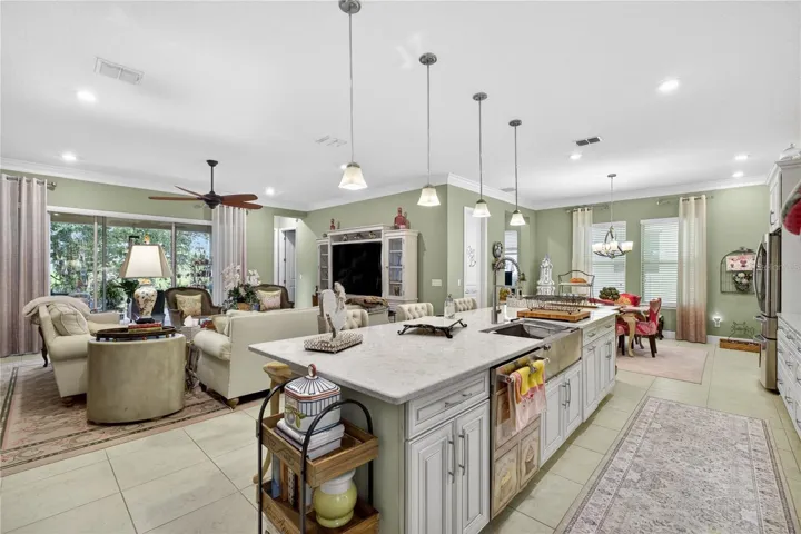 Open-concept living space featuring a family room with sliding glass door access.