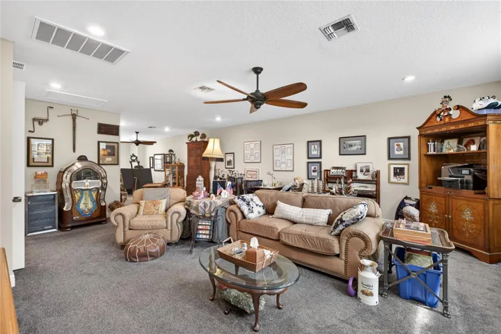 Upper floor featuring entertaining room with carpet