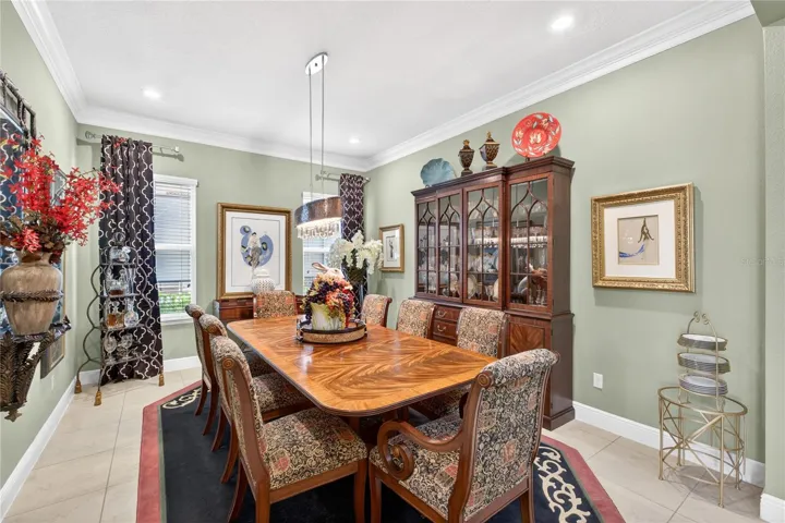 Dining room featuring elevated ceilings.