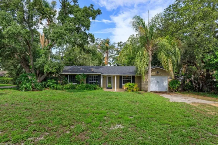 Front of home on large shaded corner lot