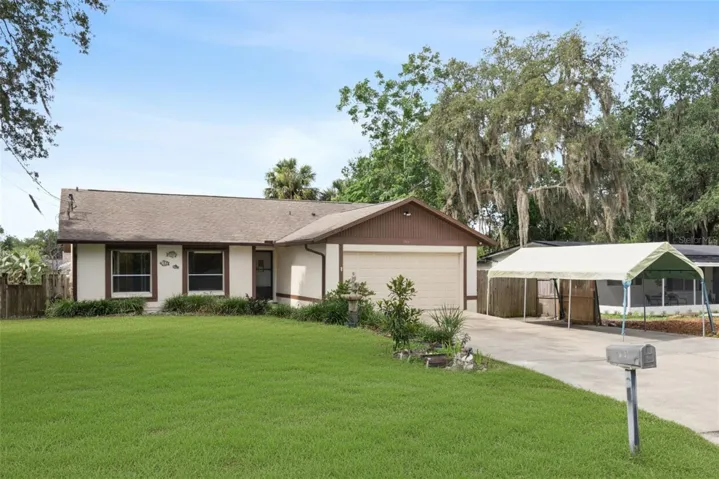 Well Maintained 3 Bedroom/2 Bedroom Home/Screened In Lanai / 2 Car Garage and 1 Carport /Fully Fenced Backyard