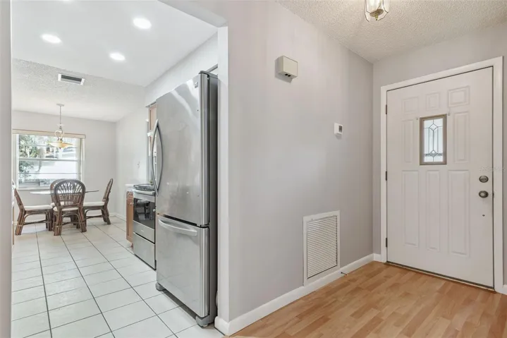 Main Entryway and View of Kitchen