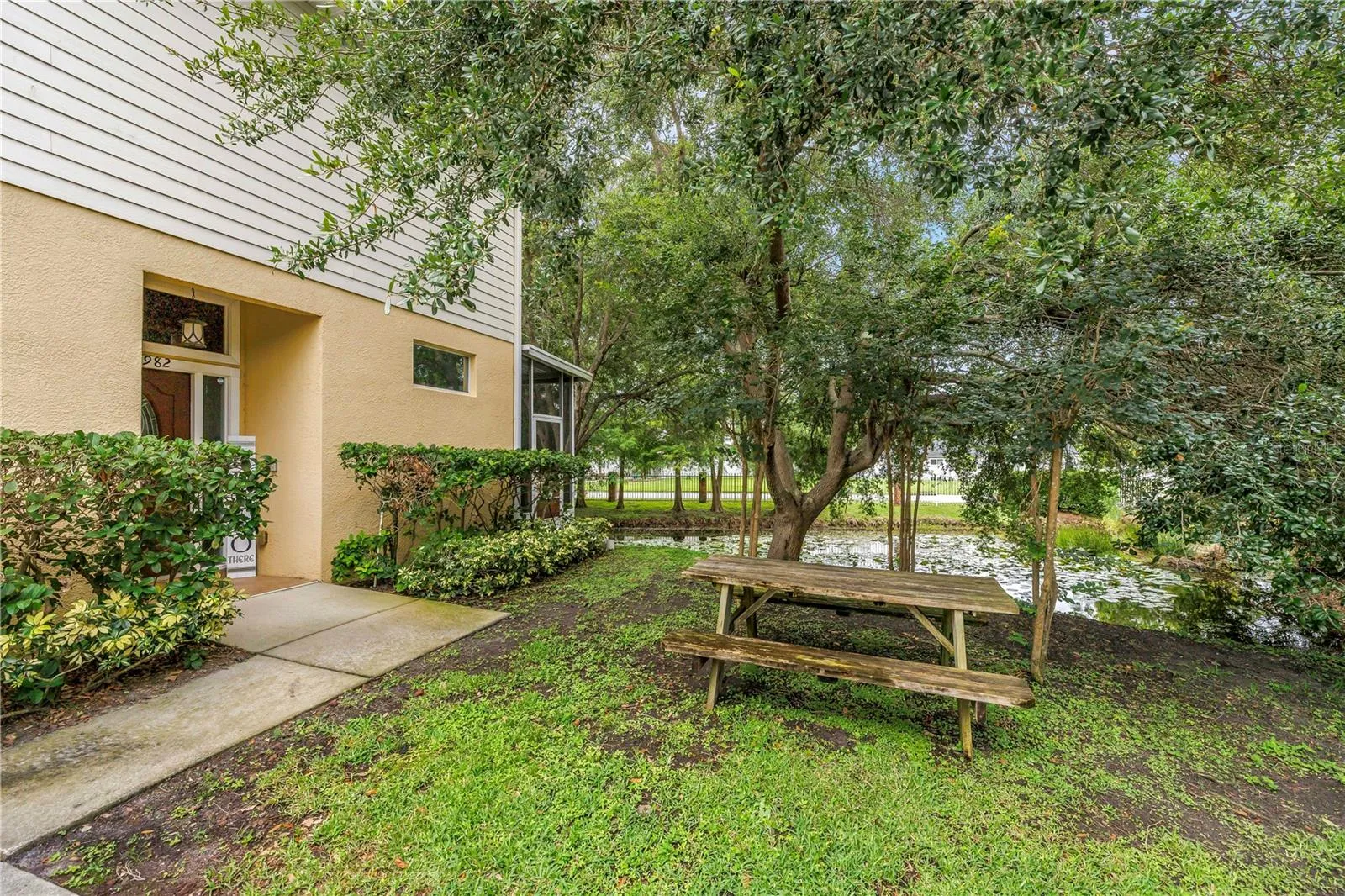 Picnic area with view of pond at front (side) door.