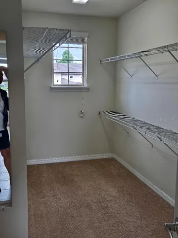 SIDE BY SIDE WALK IN PRIMARY CLOSET