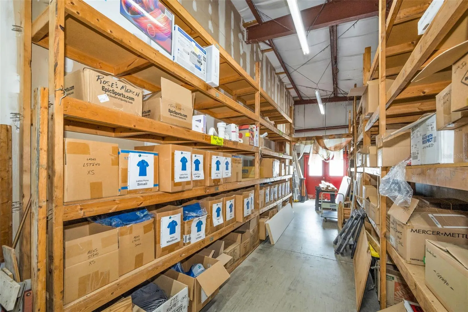 Warehouse storage area with entry doors on the north end.