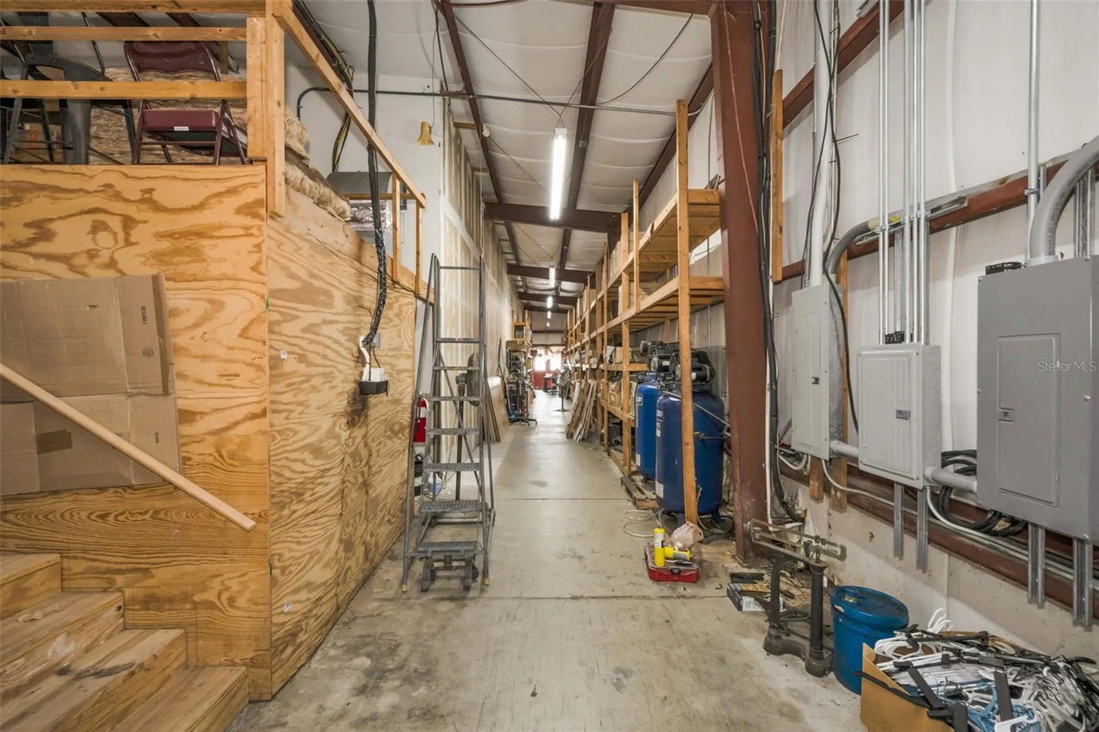 Warehouse storage area and access to mezzanine.