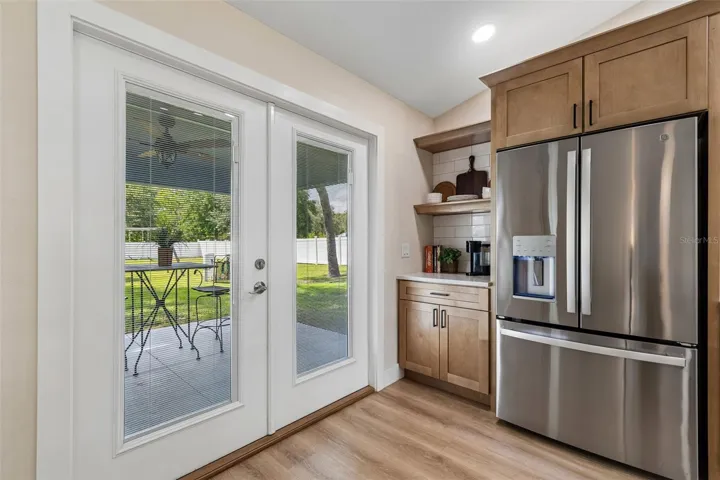 Double paned french doors lead to the covered patio