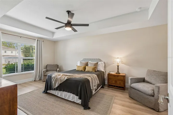 Owner's suite with tray ceiling and extra room for a desk or extra sitting.