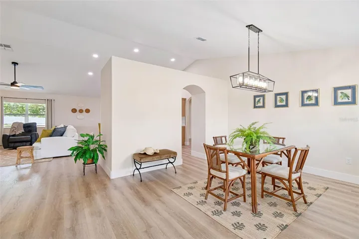 From Entry.  Nice dining space that opens to kitchen and great room. Vaulted ceilings and 5 1/4 baseboards.  Everything you see has been remodeled.