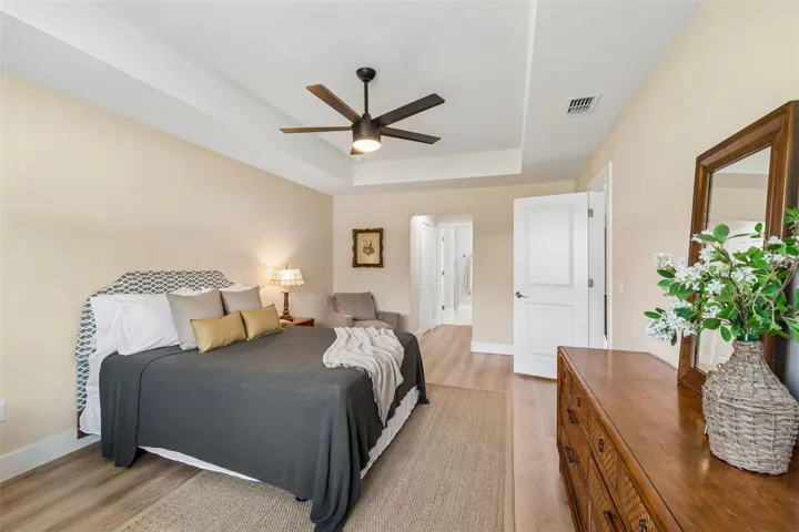 His and her walk-in closets lead to the bathroom suite.