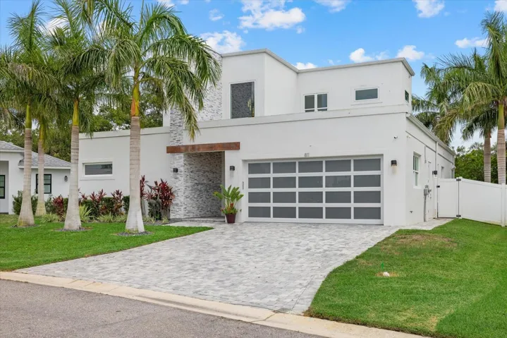Front Elevation Landscaped with 3 Royal Palms