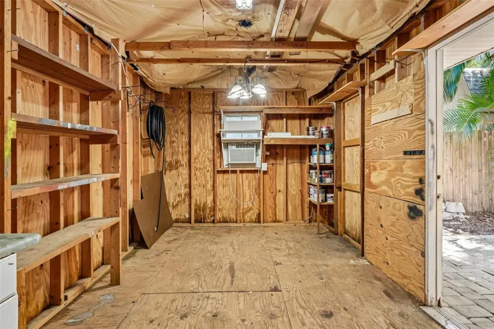 Detached workshop with shelving and A/C