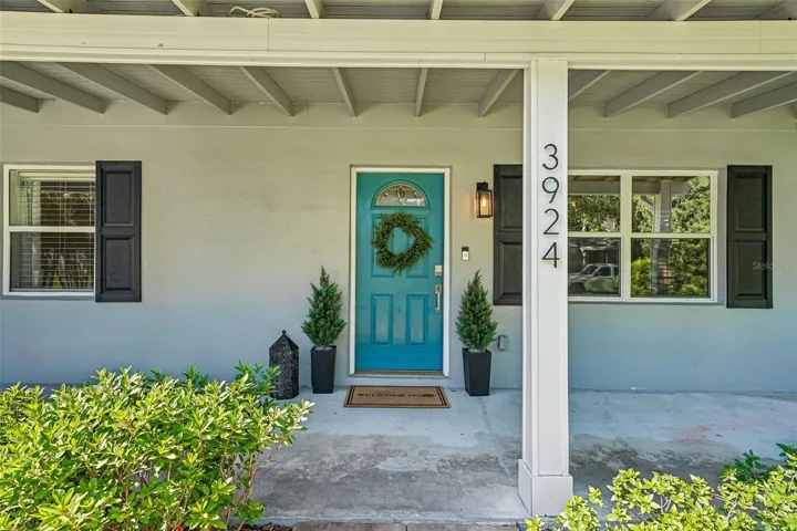 Classic covered front porch spans the front of the home.