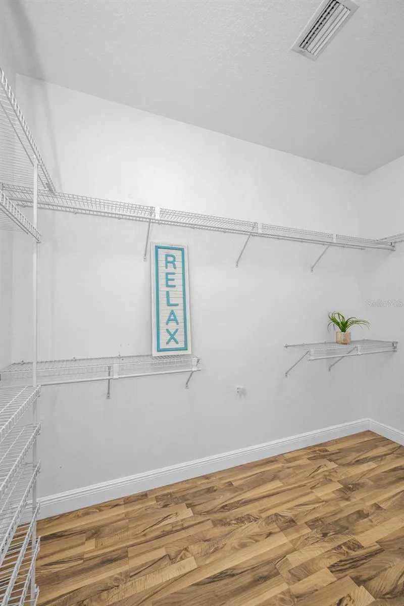 This closet is as big as a bedroom.