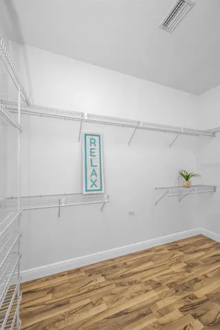 This closet is as big as a bedroom.