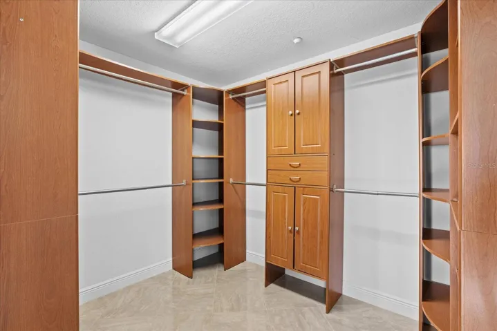 Well sized and nicely appointed primary walk in closet