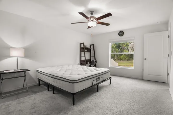 Large primary bedroom with views of the creek
