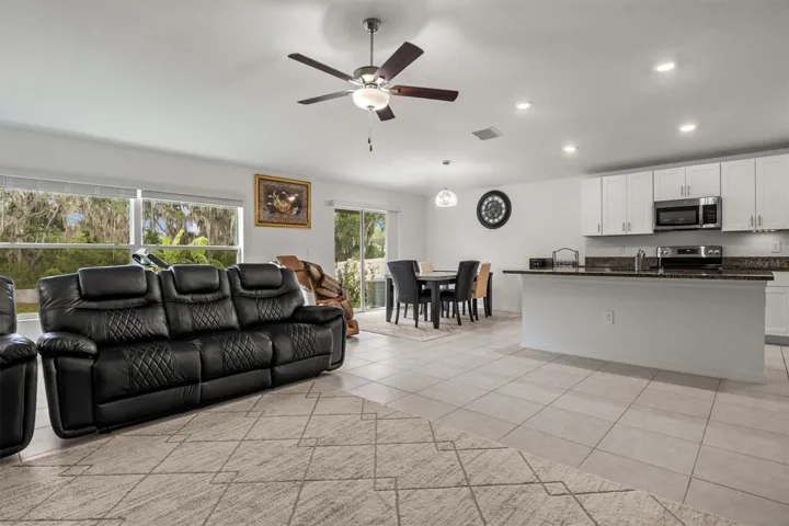 View of living room, dining room and kitchen