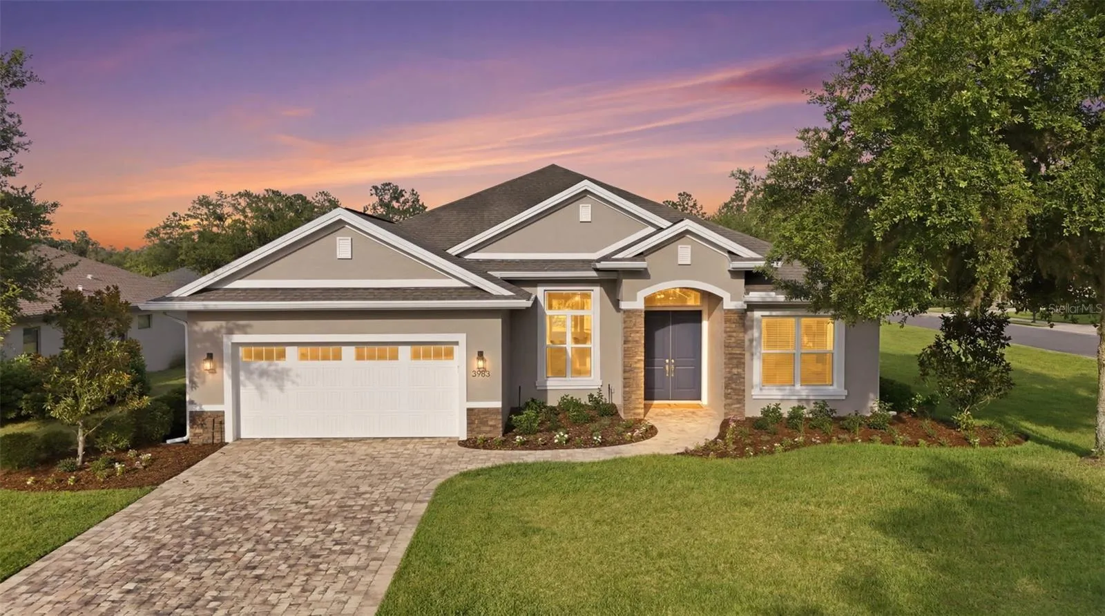 Beautifully illuminated exterior showcasing exceptional curb appeal