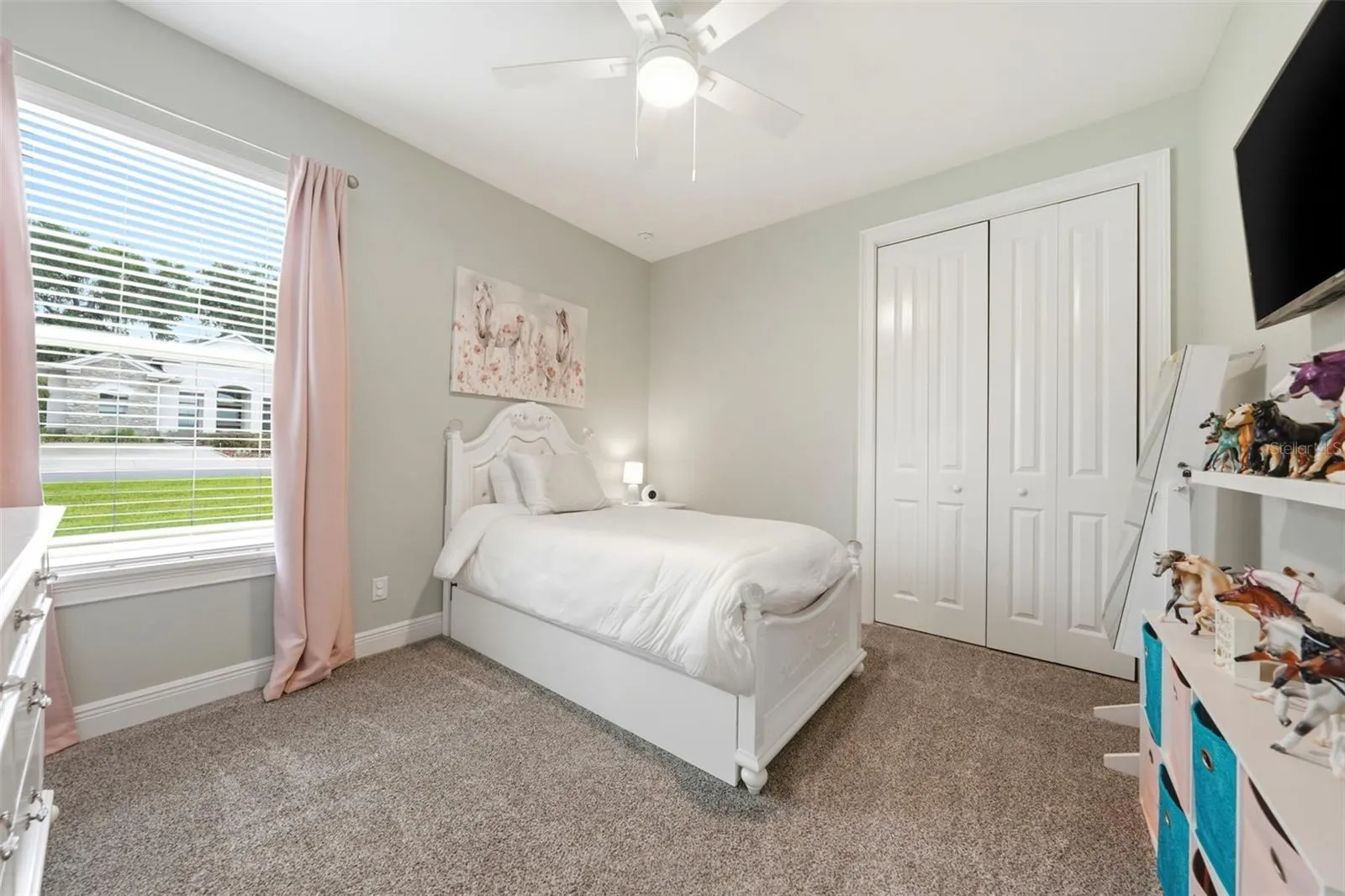 Generously sized bedroom with views of large side yard