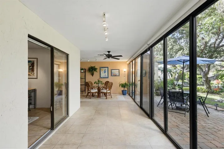 Florida room with sliders to the rear patio