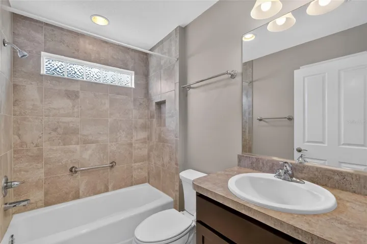 Hall bathroom with tub and shower combo