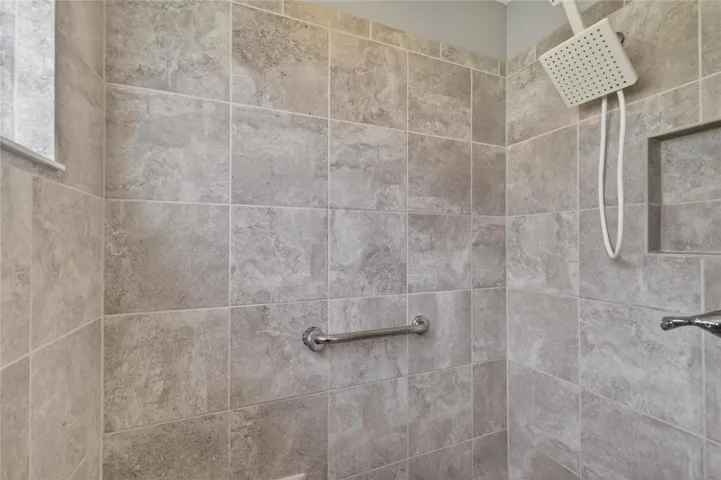 Primary walk-in Roman style shower