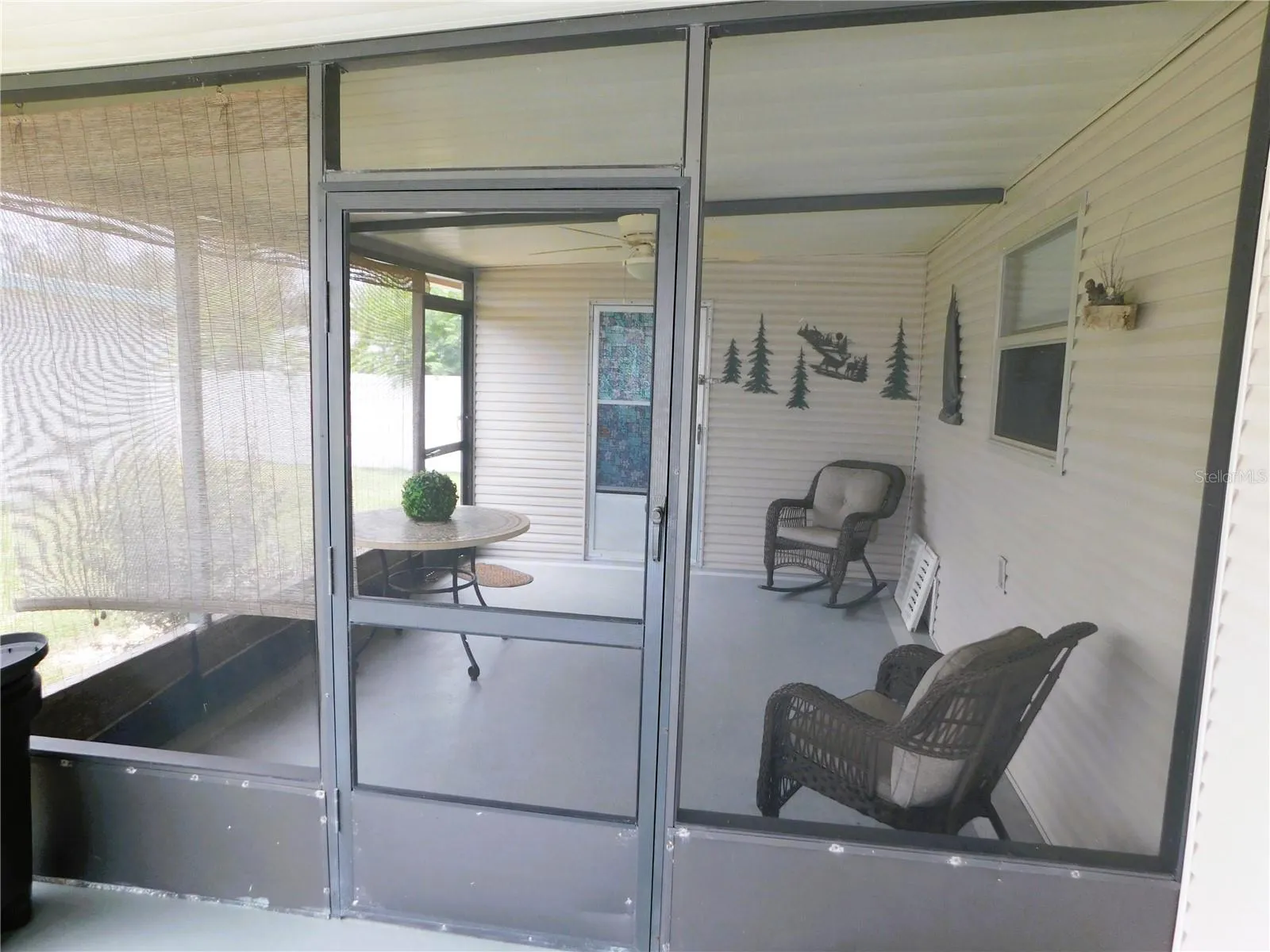 Wonderful screen room off the carport.