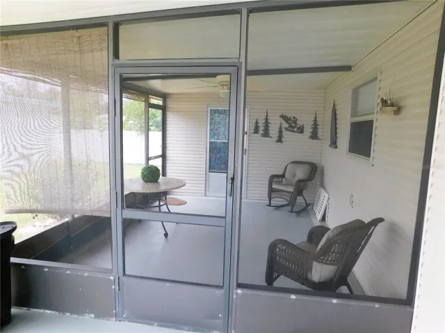 Wonderful screen room off the carport.